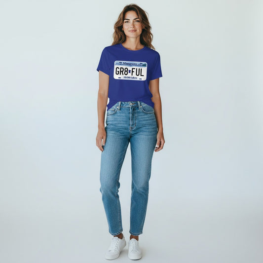 Woman wearing GR8FUL Minnesota graphic t-shirt with license plate design