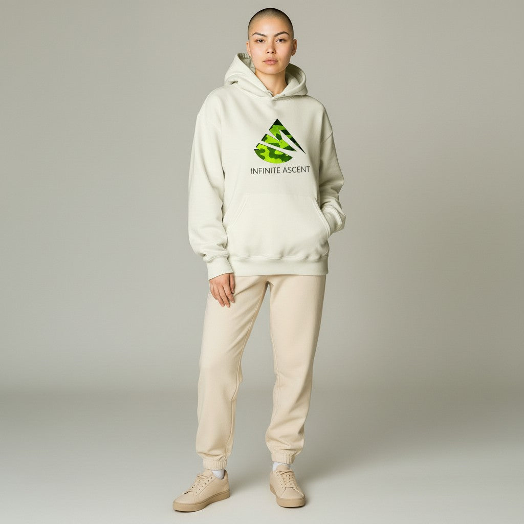 Person wearing a white hoodie with a logo and text, standing against a plain background