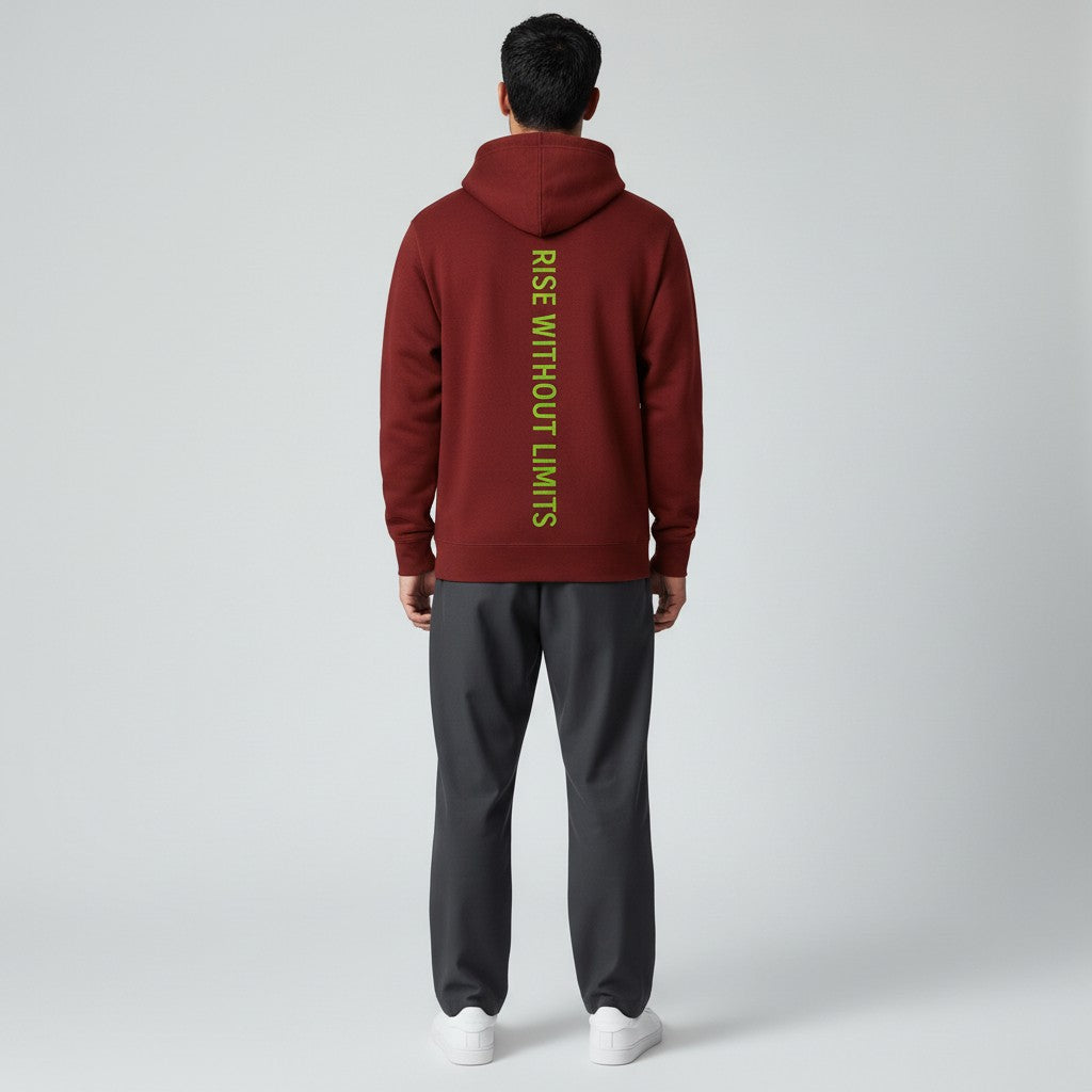 Person wearing a maroon hoodie with yellow text and gray pants on a white background